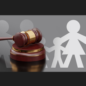 Judge's gavel resting over a paper cutout of a family holding hands